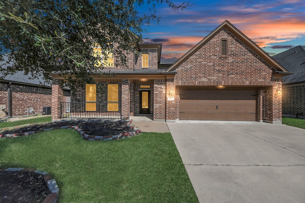 This inviting brick home features a two-car garage