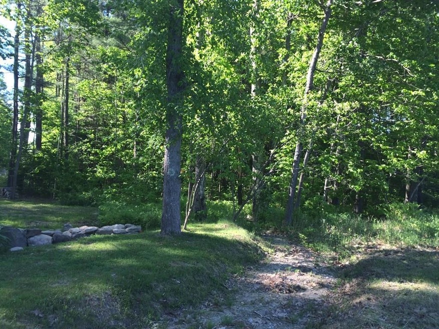This gently wooded site begins at a...