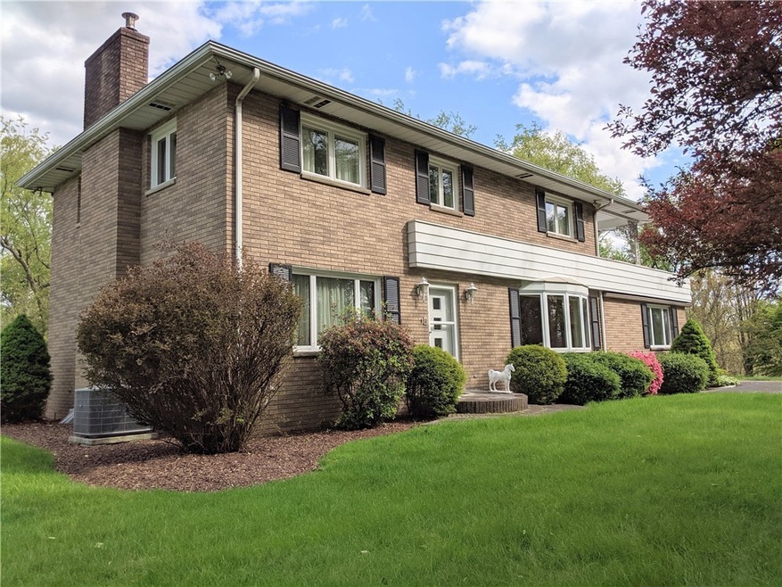 2 story brick home with upper level sun deck of ma