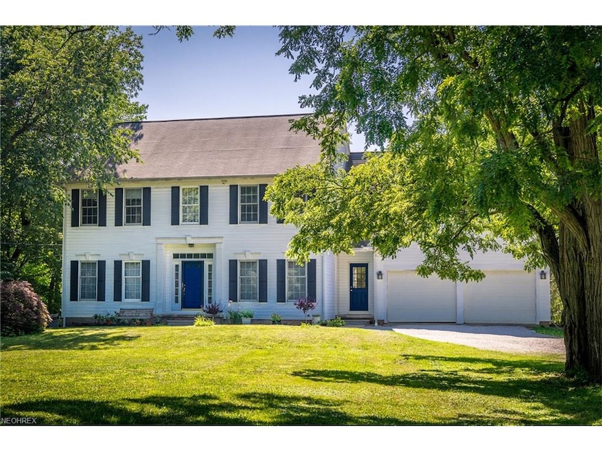 Classic center hall colonial on beautiful 1.5 acre