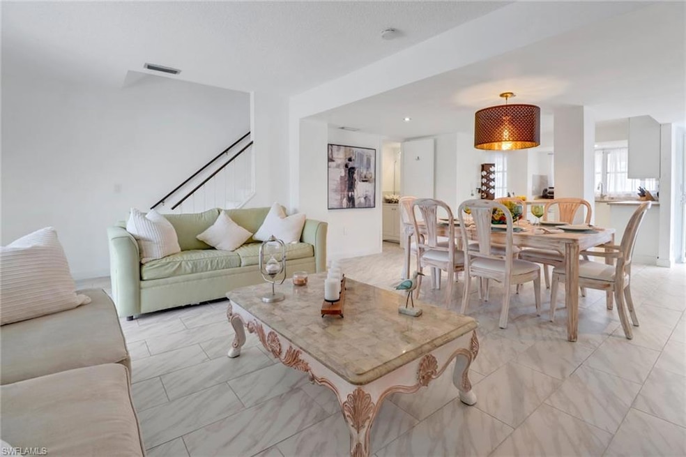 Living room with light tile patterned flooring