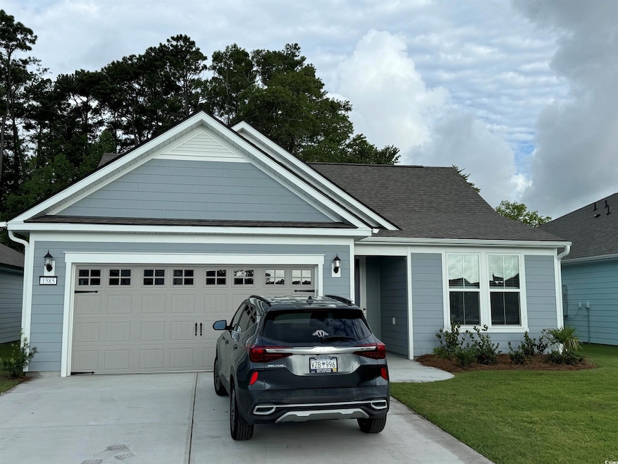 View of front of property featuring a garage and a