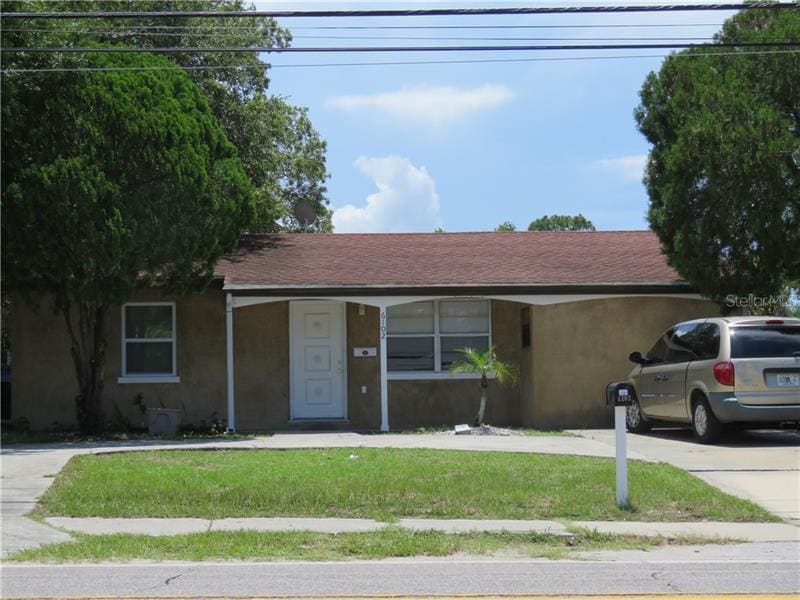 Front of the home has a circular driveway.