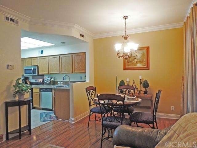 Open floor plan, beautiful crown moldings and base