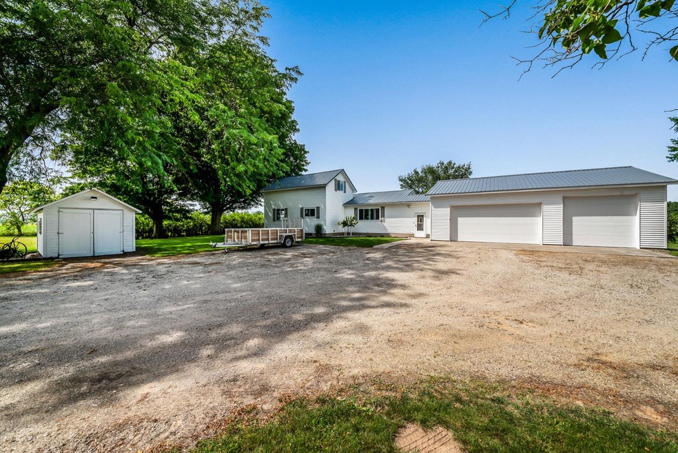Side of house with garage and shed