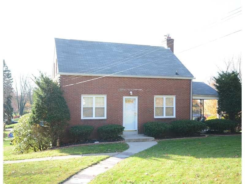 Exterior Front. Spacious charming all brick cape cod on a large level yard.