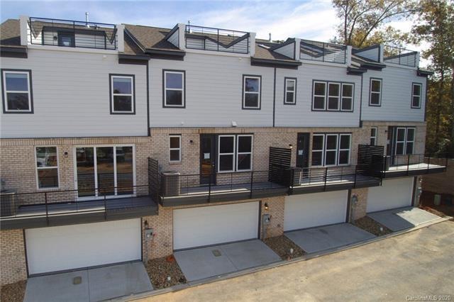 Rear of home featuring the two car side-by-side ga