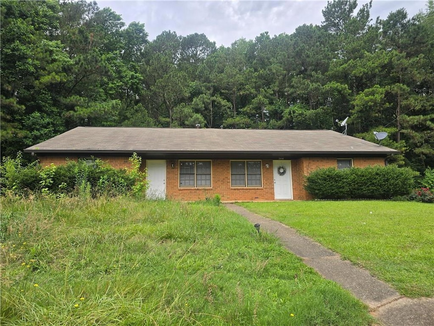 Ranch-style house with a front lawn