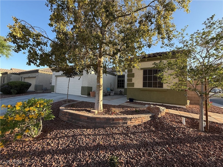 View of front of home featuring concrete driveway,