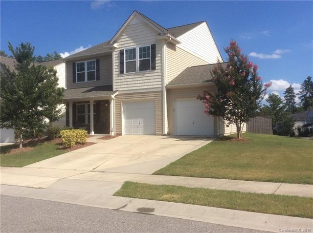 Beautiful stone and vinyl  home with double car ga