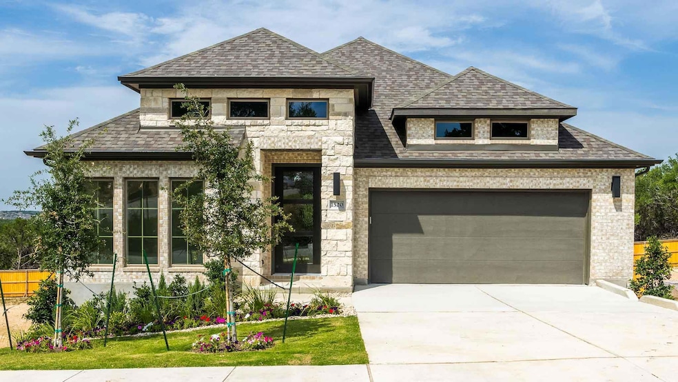 View of front of home featuring roof with shingle