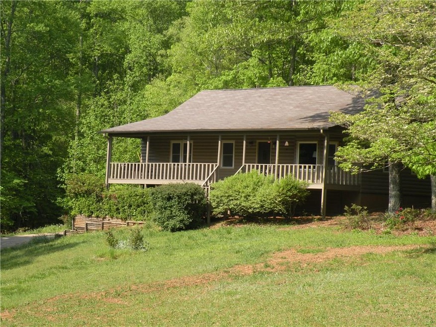 Log cabin style home on 17+ acres