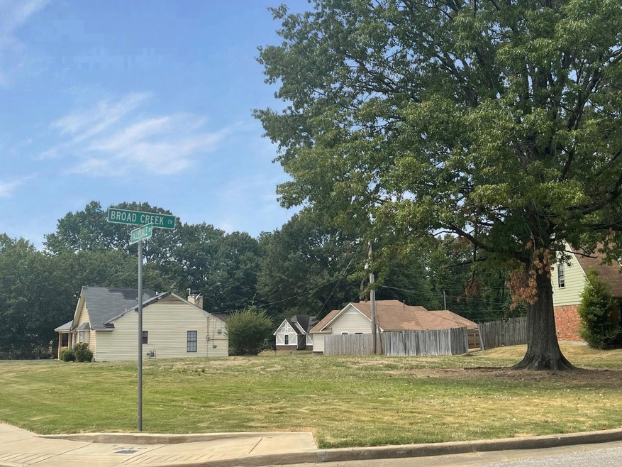 View of property exterior featuring a lawn