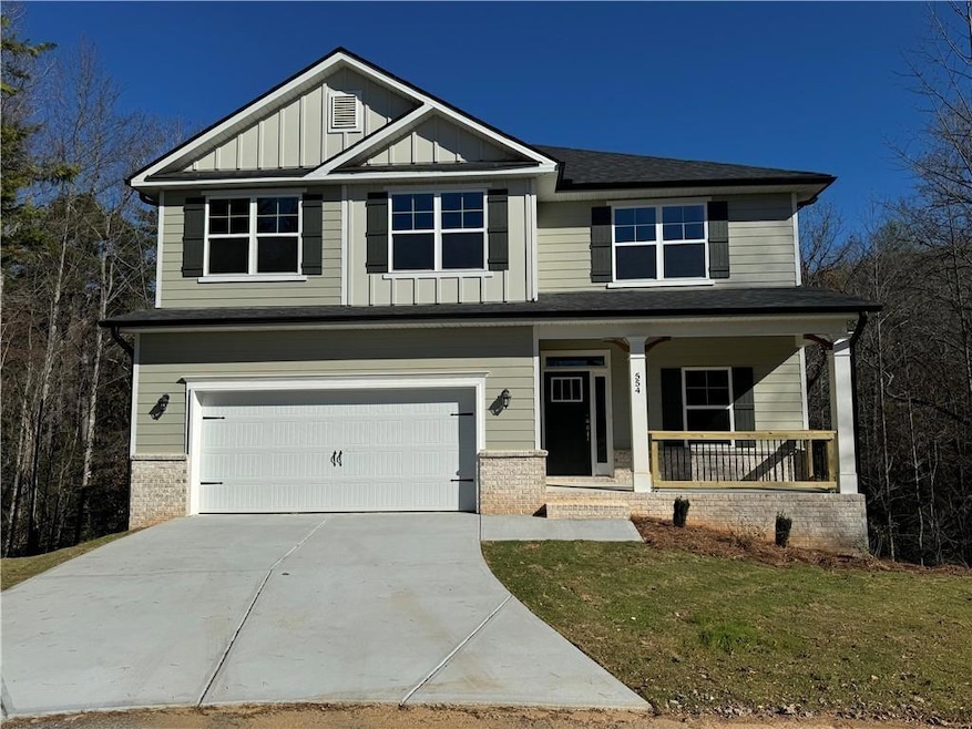 Craftsman-style home with covered porch, board and