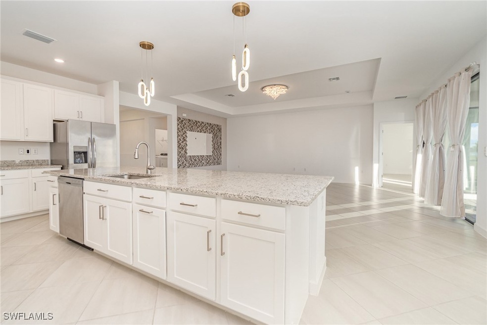Kitchen with appliances with stainless steel finis