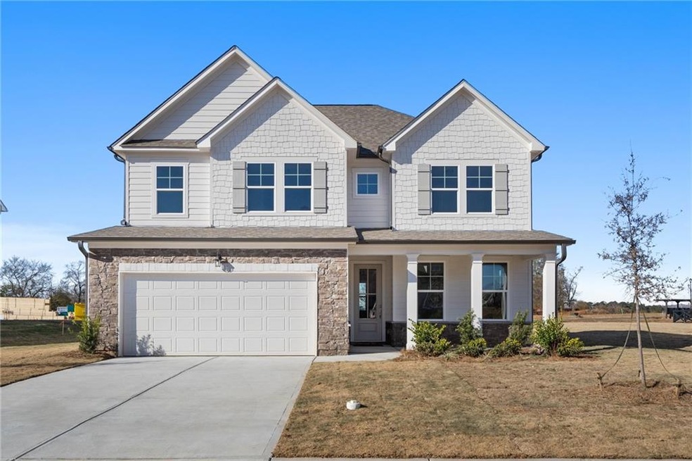 Craftsman house featuring a garage and a front law