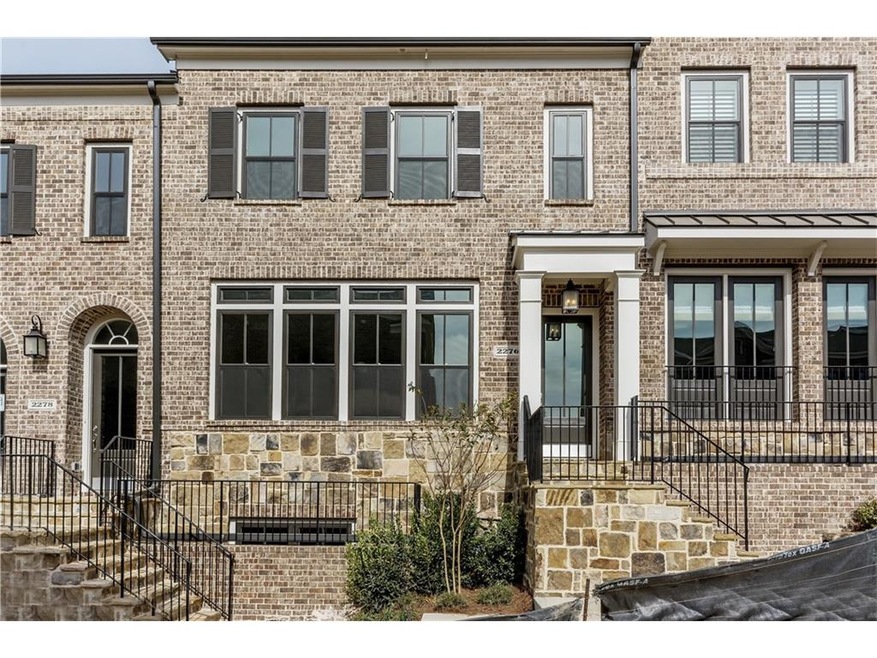 Handsome four-sided stone and brick exterior welco