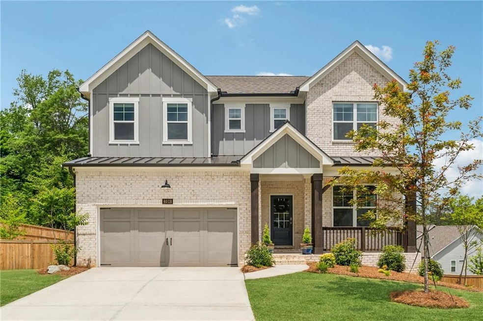 Craftsman house featuring a front lawn and a garag