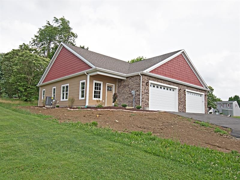 Maintenance free vinyl siding and stone front on n