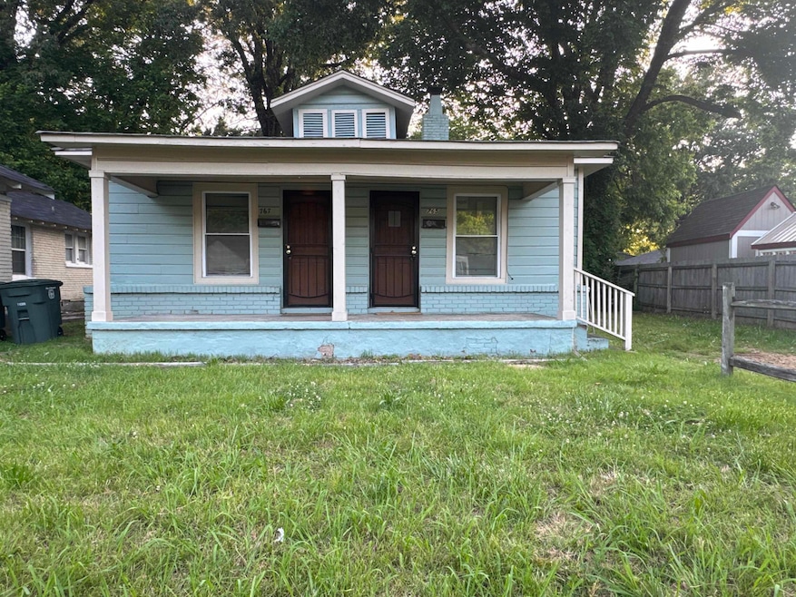 Bungalow featuring a porch and brick siding