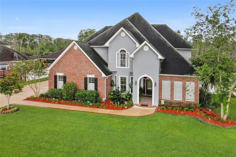 Beautifully Landscaped front yard. Oversized drive