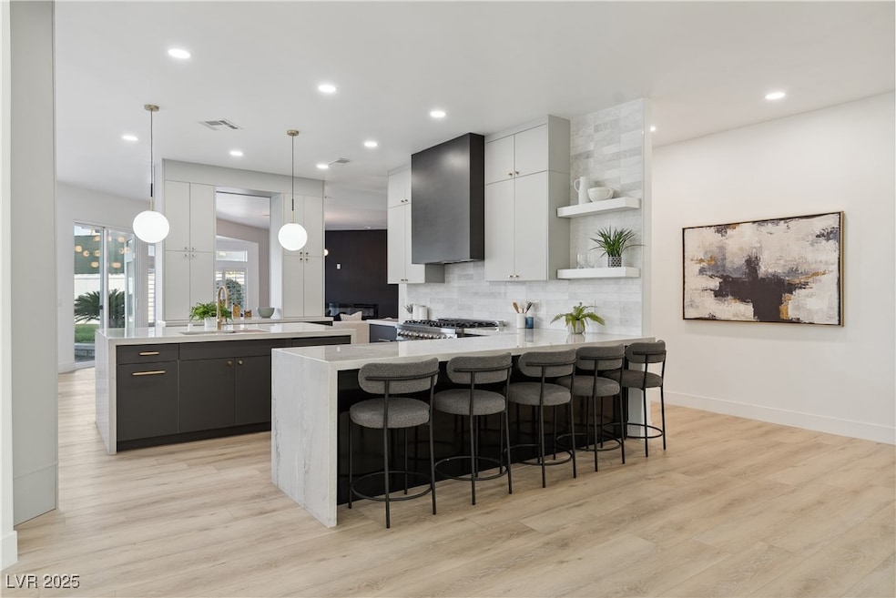 Kitchen with a peninsula, open shelves, light coun