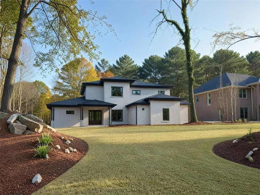 Back of house featuring a yard