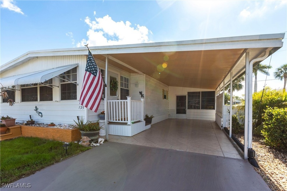 View of front facade featuring a carport