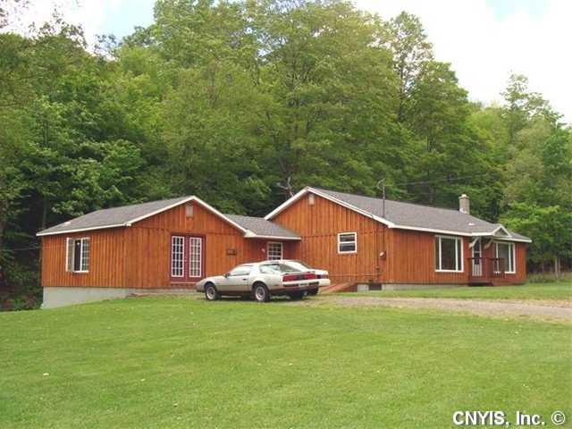 Exterior Front. WOOD BATTEN BOARD SIDING. NEW ROOF