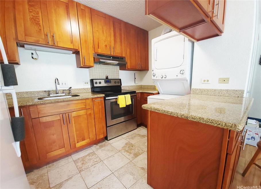 Open kitchen layout, with breakfast bar.