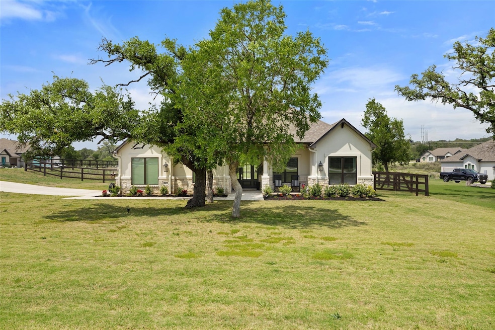 View of front of home with stone siding and stucc