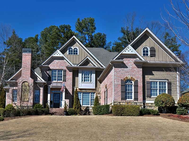Exterior Front. Stately 3 sided brick/stone & conc