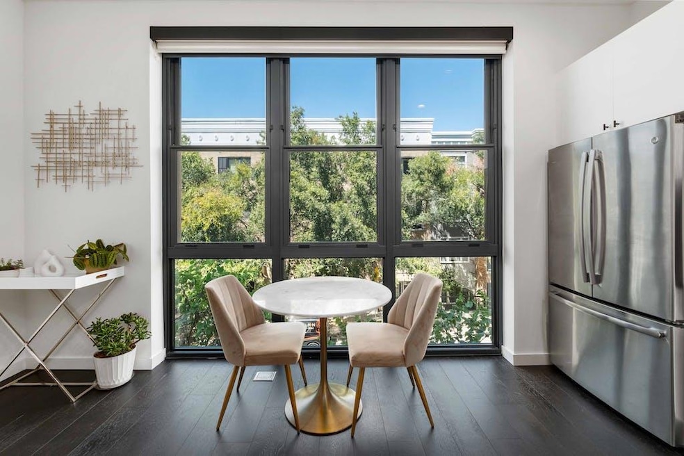 Dining room with dark wood-type flooring and base