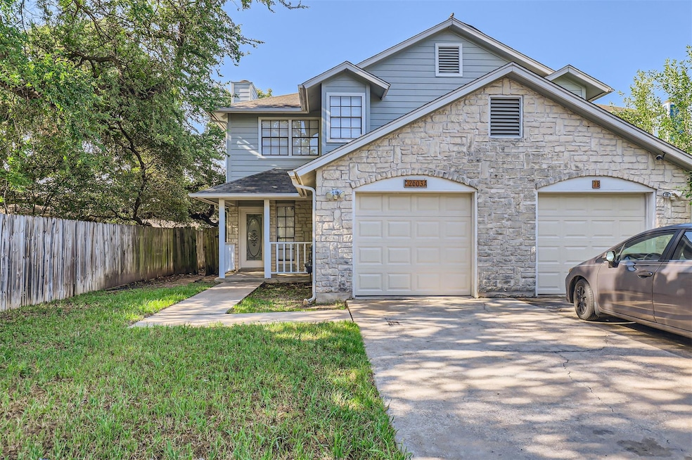 View of front of property featuring stone siding,
