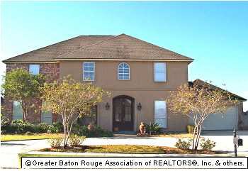circular driveway, 2 story, brick and stucco, 2 ca