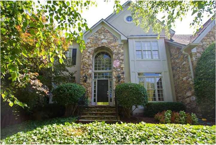 Exterior Front. Sited on a private lot with mature