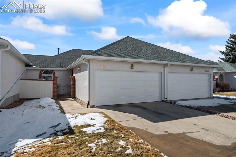 View of front of townhome featuring an enclosed pa