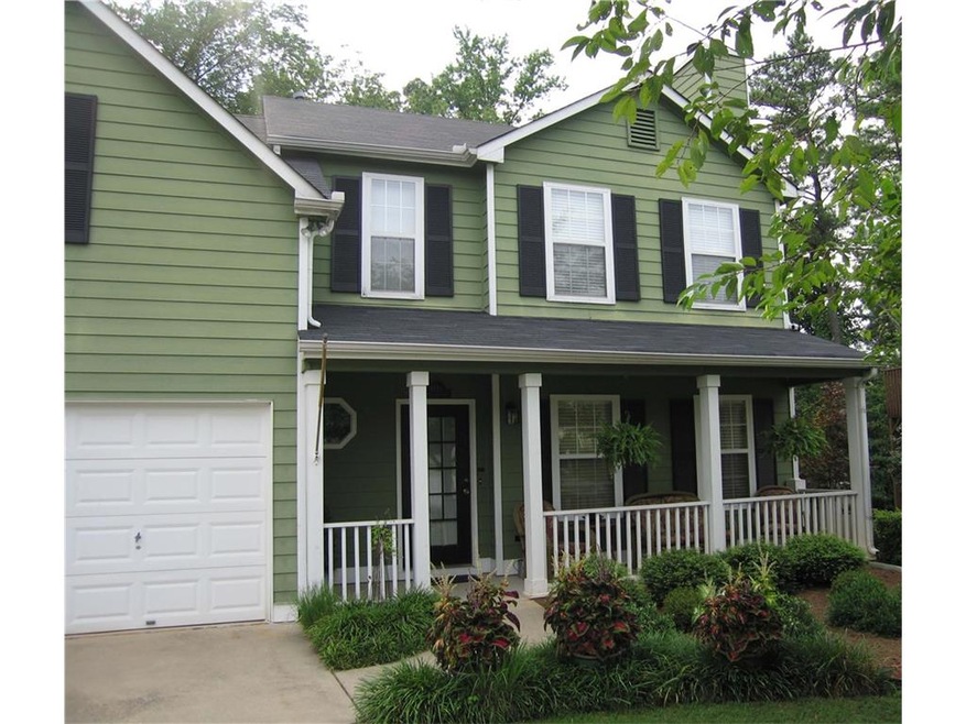 Presenting a beautiful home with lush landscaping.