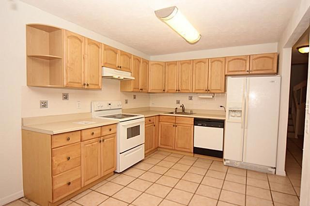 Clean cabinets and plenty of counter top space mak