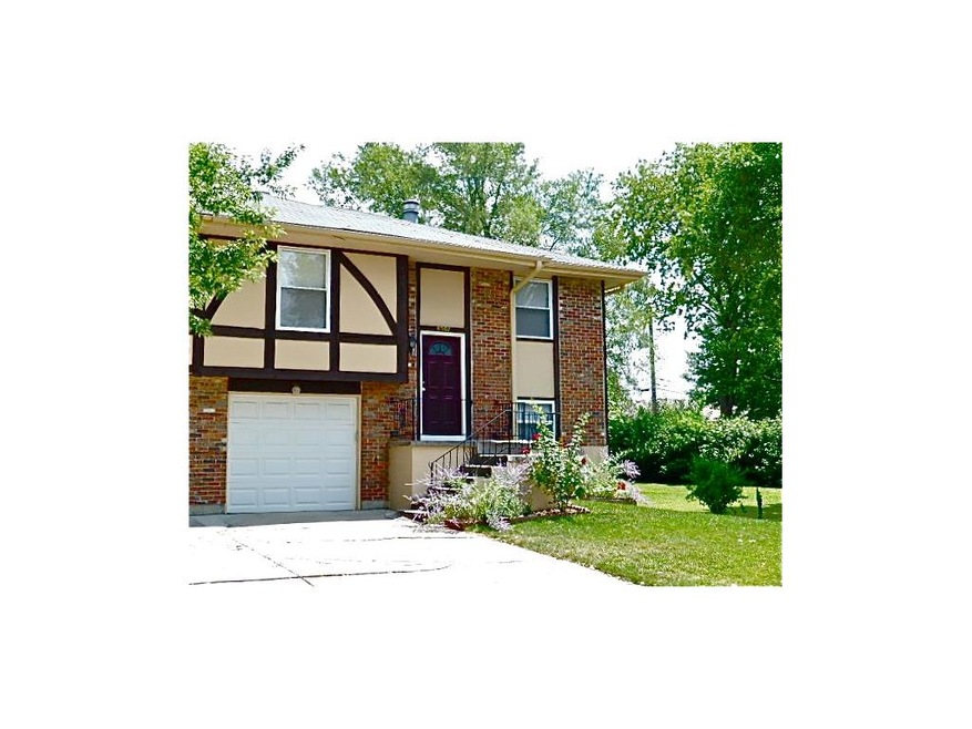 Inviting entrance with manicured lawn, adjoining o