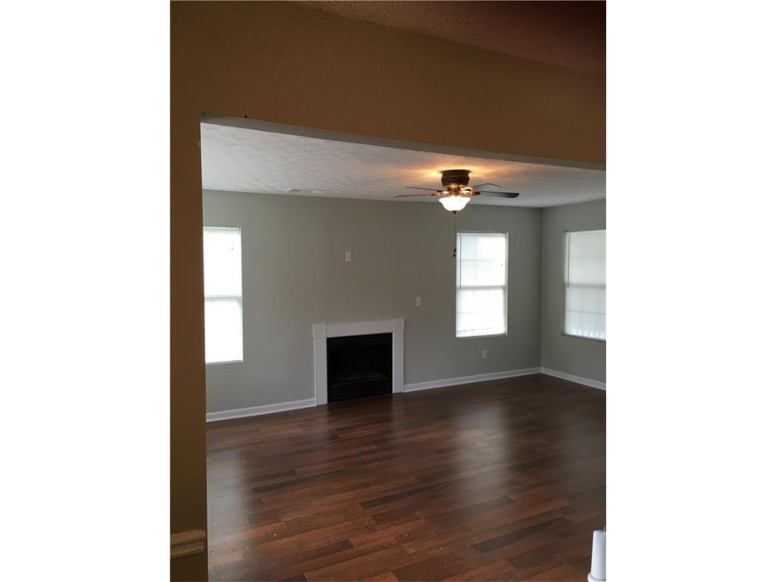 Family room with new floors and fireplace
