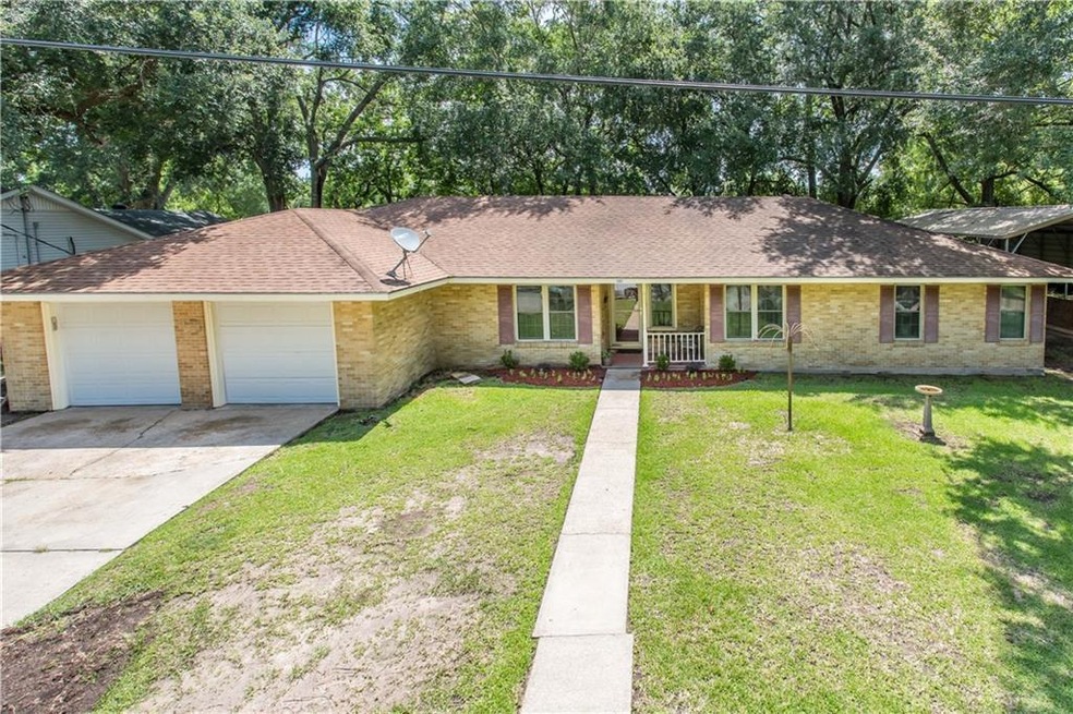 Front Exterior  - Well maintained brick home on sl
