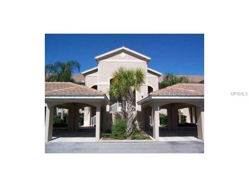 Front Exterior of Condo with 1 car Carport