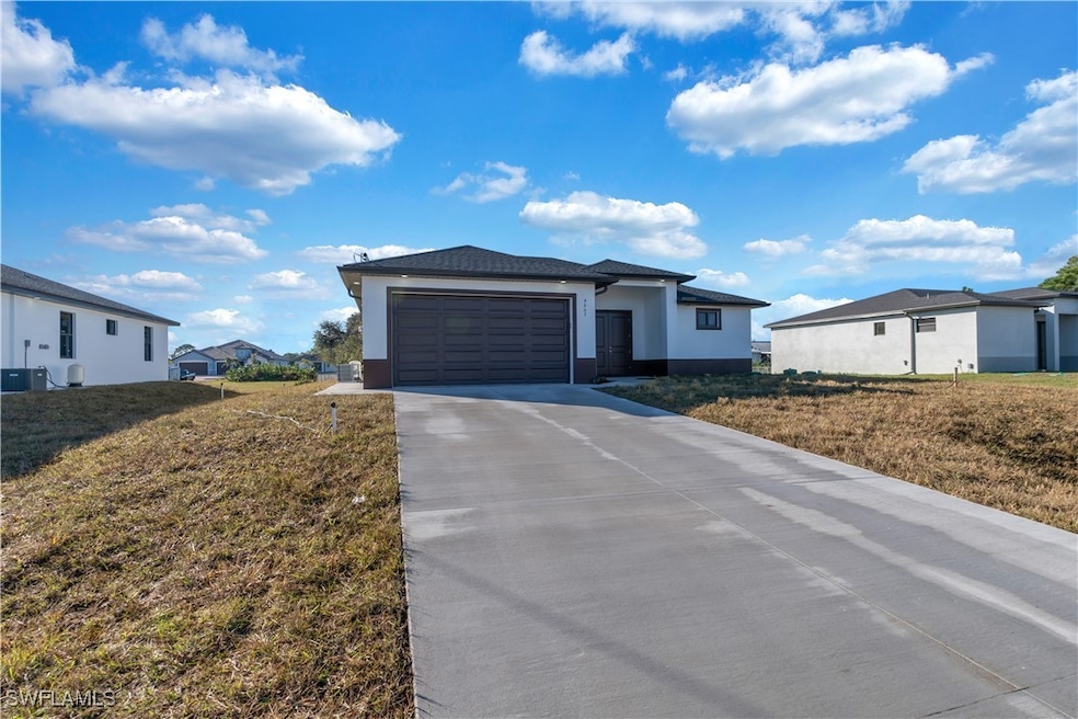 View of front of house featuring a garage and a fr