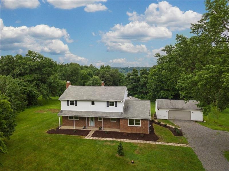 This home has it all! Park like setting on 4 acres