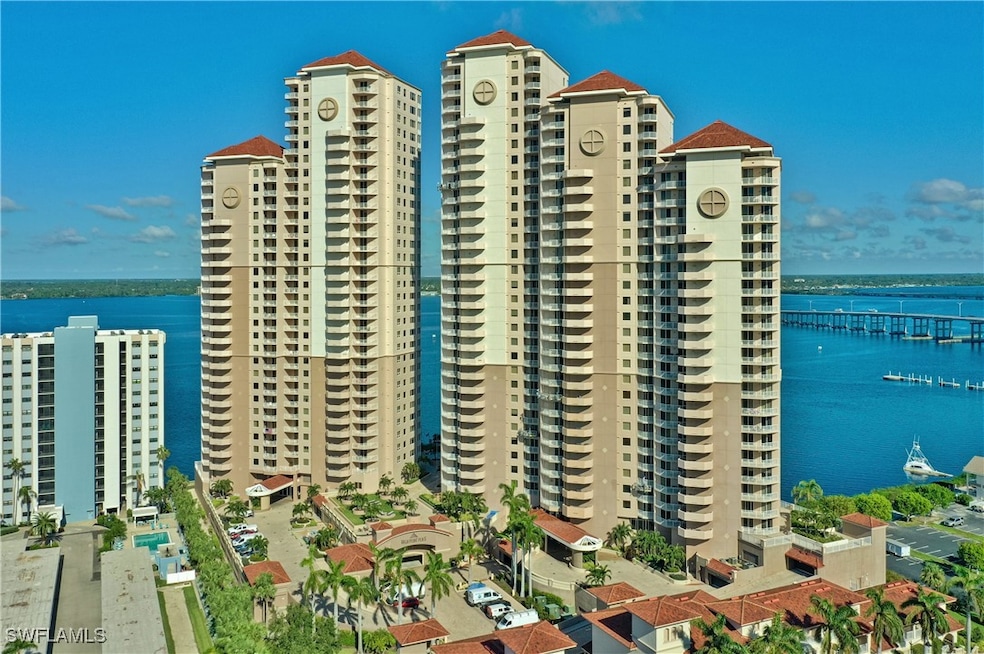 View of property with a water view