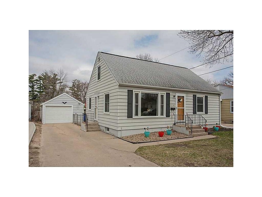 Front Exterior. and the one car detached garage wi