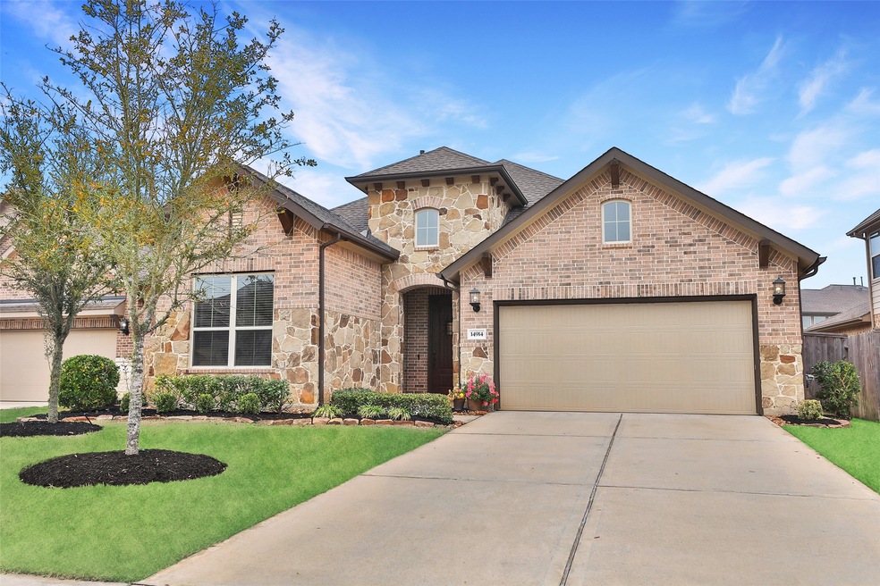 Welcome home to your beautiful ONE STORY residence located at 14914 Scarlet Finch Way in Cypress Texas.  This home is inviting and loaded with attractive features. This view of the front of the residence shows the attention to landscaping and detail of the home. LOCATION! LOCATION! will not disappoint!