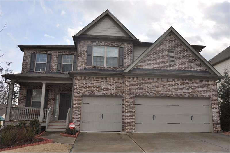 Exterior Front: Notice the porch and 3 car garage