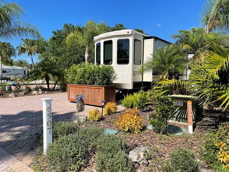 Mature landscape, Clay pavers, irrigation, outdoor lighting and an outdoor shower are in place and ready for you to park your recreational vehicle.